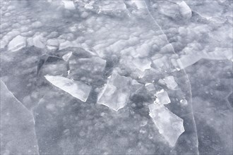 Chunks of ice on a frozen surface