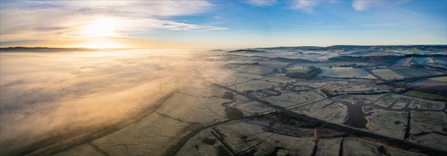 Sunrise panorama over RSPB Exminster and Powderham Marshes and River Exe