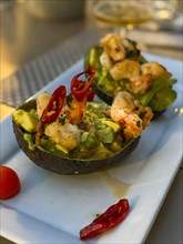 Grilled king prawns with avocado salad and peppers