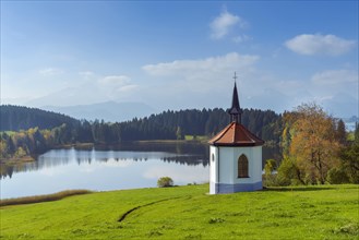 Lake Hegratsried with little Gothic chapel in autumn