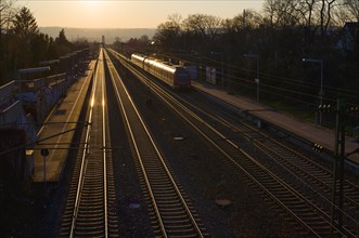 Tracks with suburban railway in the evening light