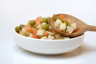 Ingredients for Russian salad in bowl