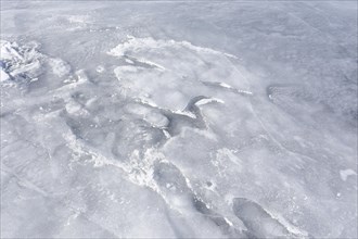 Ice pattern on a frozen surface