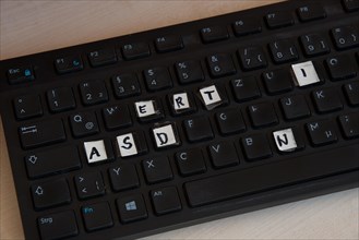 A computer keyboard with keys covered in letters
