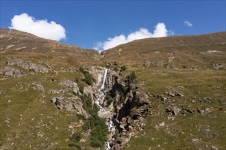 Mountain stream with waterfall in Rofental