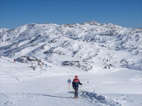 Snowshoe hiker in winter landscape