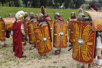 Traditional group of Roman legionaries in historical uniform equipment doing exercise in Circus Maximus