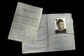 Old driving licence from 1963 on black background