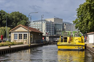 Yellow passenger ship in the Muehlendammschleuse in Mitte