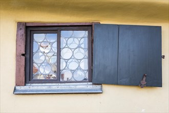 Window with leaded glass and crooked shutter at the house where Johann Sebastian Bach was born