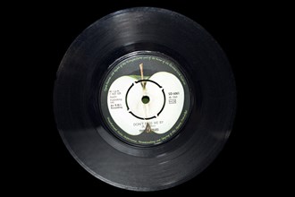 Old single record by the Beatles with the song