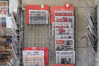 Sales stand with various daily newspapers