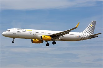 A Vueling Airbus A321 with registration number EC-MHA lands at the airport in Barcelona