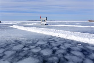 Ice pattern with fishing hut