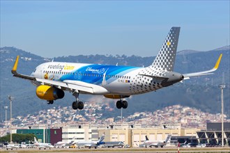 A Vueling Airbus A320 with the registration EC-MLE and the 25th anniversary Disneyland Paris special livery lands at the airport in Barcelona