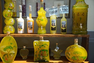 Bottles of Limoncello outside a shop in Ravello
