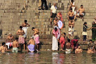 Worshippers on the banks of the Ganges during ritual ablutions in Varanasi