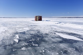 Ice fishing hut on the frozen Saint Lawrence River