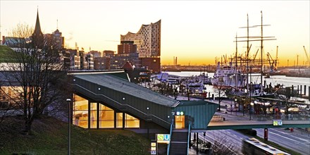 Elbe Philharmonic Hall with the Landungsbruecken underground station at sunrise