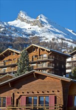 Valais chalets and holiday homes under the snow-capped Pointe de Chemo peak