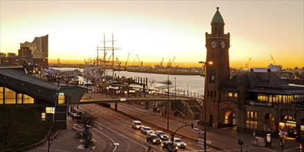 Elbe Philharmonic Hall with clock tower and gauge tower at sunrise