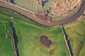 Top Down view from a drone over Meadows and Marshland around Clyst River in Topsham