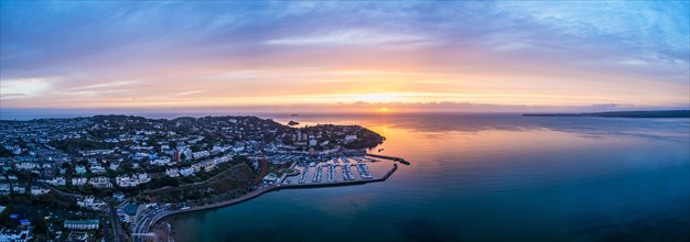 Panorama over Torquay and Torquay Marina from a drone in sunrise time