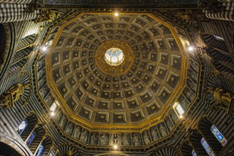 Interior view of dome of Siena Cathedral Santa Maria Assunta in Romanesque-Gothic architectural style