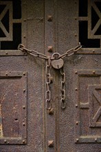 Rusty door with padlock at the Wilmersdorf forest cemetery