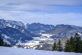 View of the Leitzachtal valley in winter from the Spitzingalmen