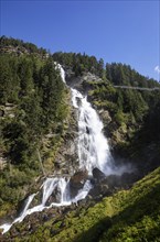 Hiking trail over a suspension bridge along the Stuibenfall near Umhausen