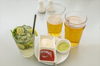 Glass of lemonade with lime and mint with Mauritian chilled beer