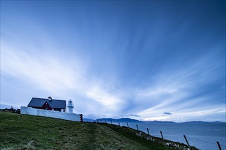 Small lighthouse on the North Atlantic at blue hour