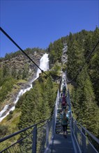 Hiking trail over a suspension bridge along the Stuibenfall near Umhausen