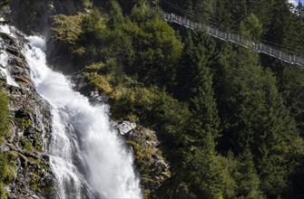 Hiking trail over a suspension bridge along the Stuibenfall near Umhausen