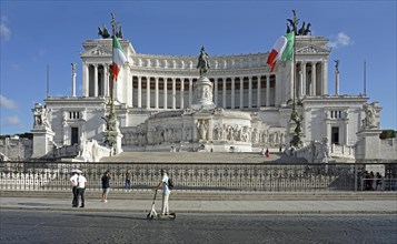 Person on e-scooter in front of Monumento Nazionale a Vittorio Emanuele II