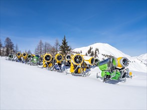 Snow cannons on a ski slope