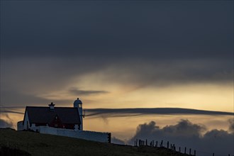 Small lighthouse on the North Atlantic at blue hour
