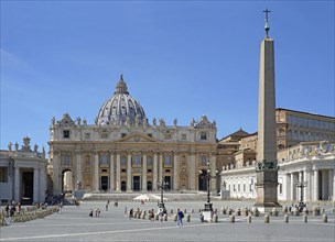 Few tourists during Corona crisis in St Peter's Square with St Peter's Basilica and Obelisk