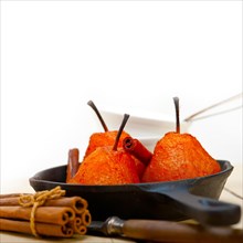 Poached pears delicious home made recipe ove white rustic wood table