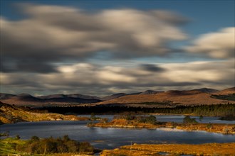 Lough Cloonee with cloudy sky in autumn landscape
