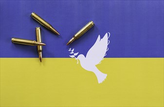 Ukrainian flag with peace dove and cartridges