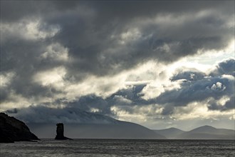 North Atlantic with rock needle and cloudy sky
