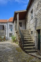 Narrow cobble street and old stone houses