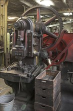 Eccentric press for valve blanks in a former valve factory