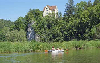 Kayakers paddling on the Danube in front of the end of Gutenstein