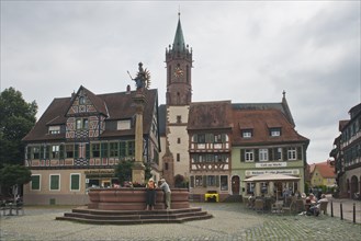 Half-timbered houses on the market square and statue of the Virgin Mary