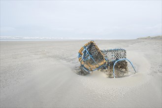 Washed-up fishing baskets on the beach
