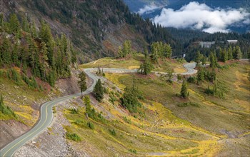 Road through autumnal mountain landscape