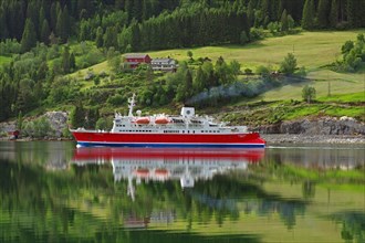 Cruise ship reflected in the fjord